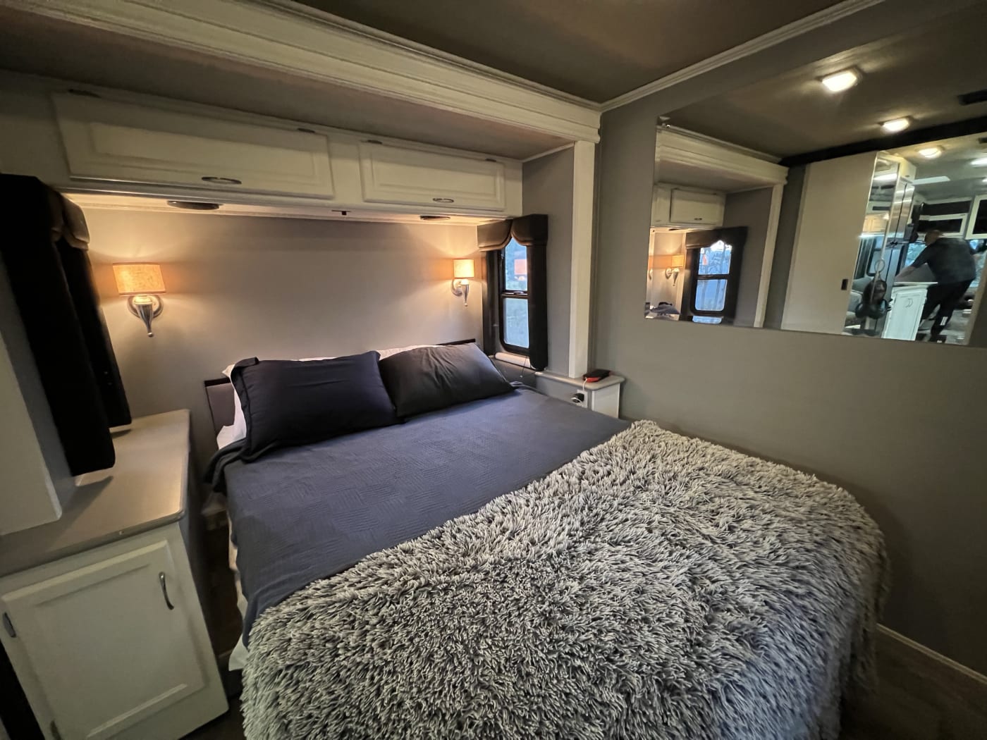 Bedroom with queen bed and storage